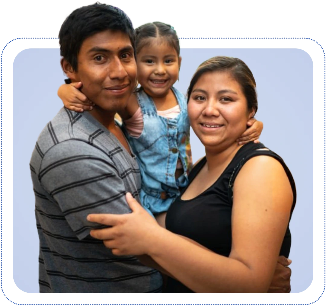 Smiling family with mother, father, and young daughter together, representing healing, resilience, and hope through ConnectionPlus trauma-informed family care.